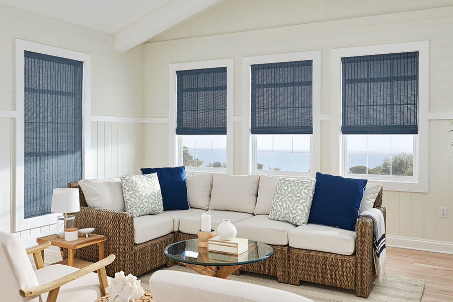 Blue natural fiber shades on living room windows