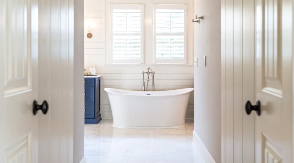 Selecting the correct window treatments for your home can be an easy process with proper planning. Polywood® shutters in a bathroom.