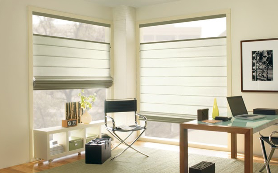Upgrade your windows with stylish window shades or shutters in Las Vegas. Stylish sheer shades in the corner of a modern office.