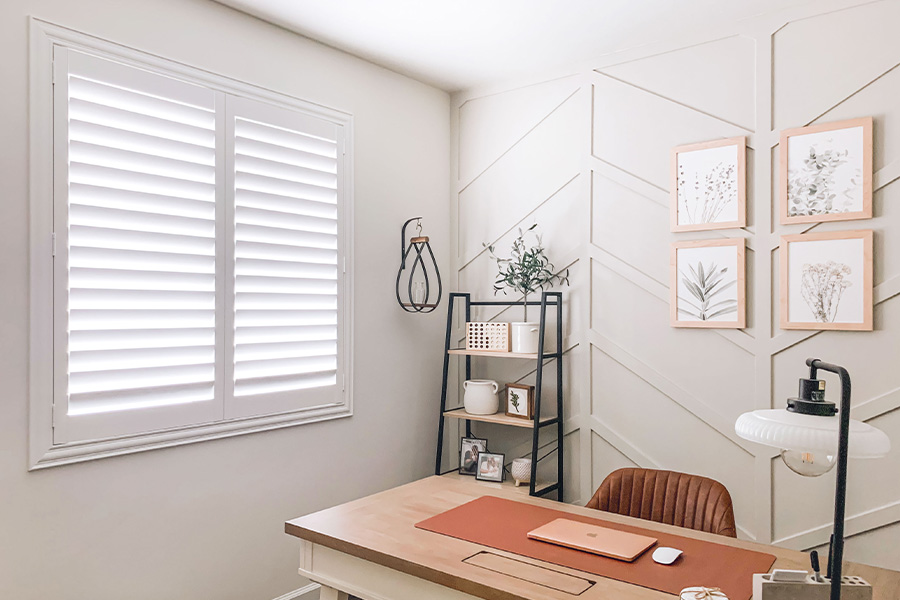 Polywood shutters give you maximum control over natural light in your Las Vegas home. Photo Credit: @OurLakepoint Farmhouse White and off-white farmhouse style office with natural light from polywood shutters.