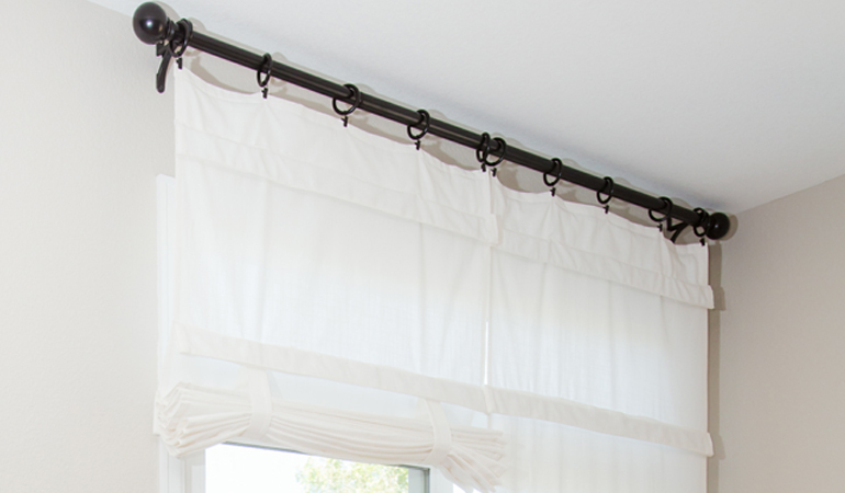 Tumble shades in Las Vegas give your doors privacy versatility and style. White tumble shade on double glass doors